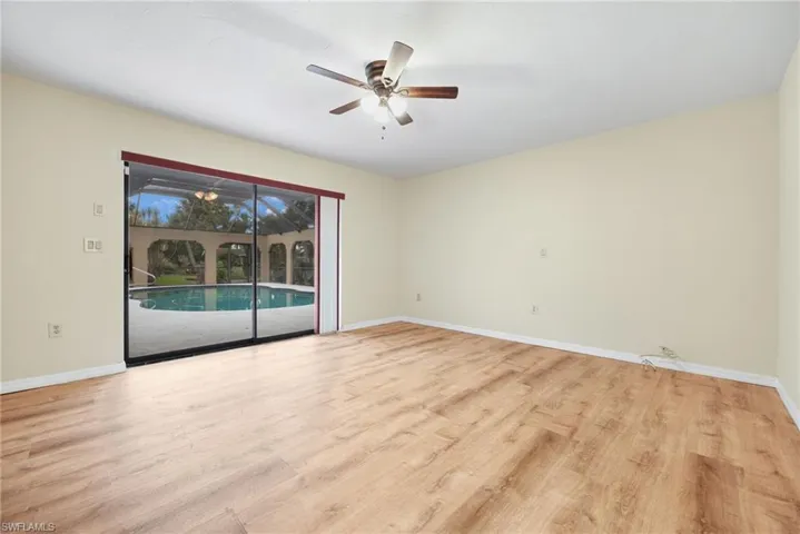 Empty room featuring ceiling fan and light hardwood / wood-style flooring