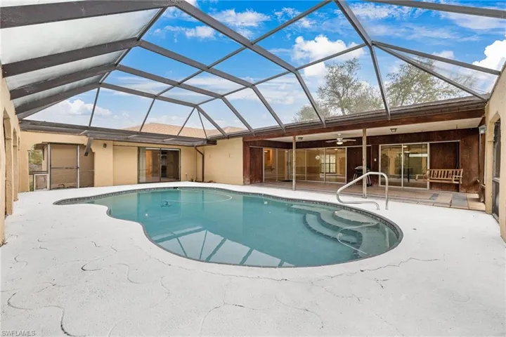 View of pool featuring a lanai and a patio