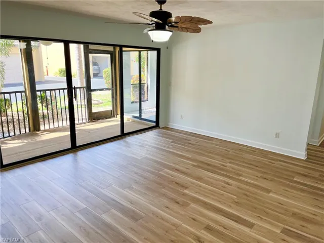 Unfurnished room featuring ceiling fan and light wood-type flooring