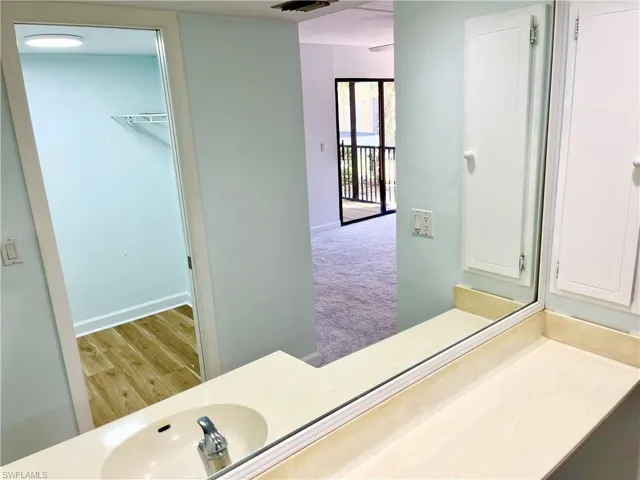 Bathroom with sink and hardwood / wood-style floors