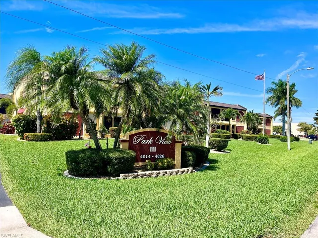 Community / neighborhood sign with a lawn