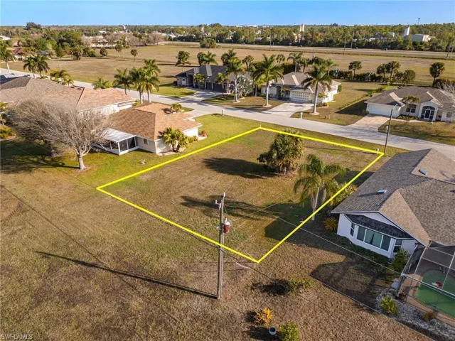 Aerial perspective of suburban area featuring property parcel outlined
