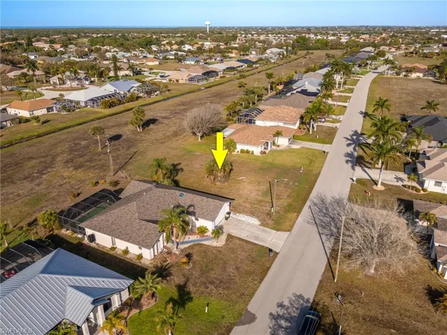 Aerial overview of property's location featuring nearby suburban area