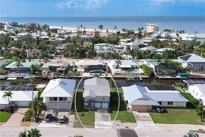 Aerial view featuring a water view off rear canal