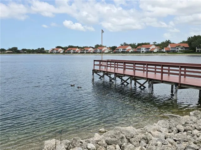 Dock with a water view and a residential view