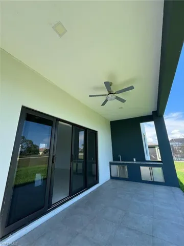 View of patio / terrace featuring ceiling fan and exterior kitchen