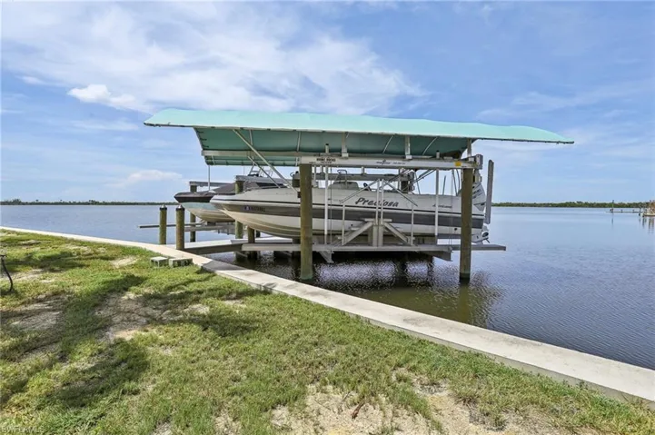 Dock area featuring a water view