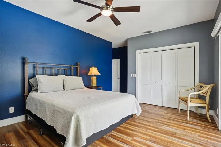 Bedroom featuring a closet, ceiling fan, and hardwood / wood-style floors