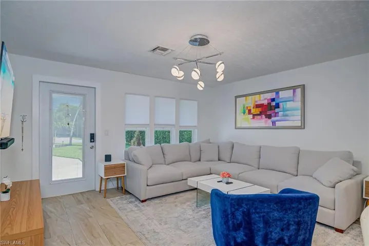 Living room featuring a chandelier