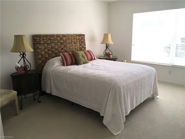 Primary Bedroom with carpet flooring