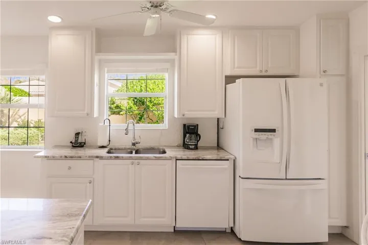Kitchen overlooks the side yard with beautiful landscaping.