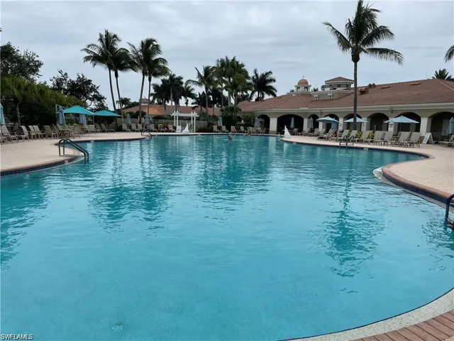 Resort style swimming pool featuring a patio