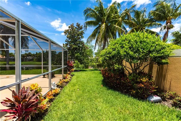 View of yard with a lanai