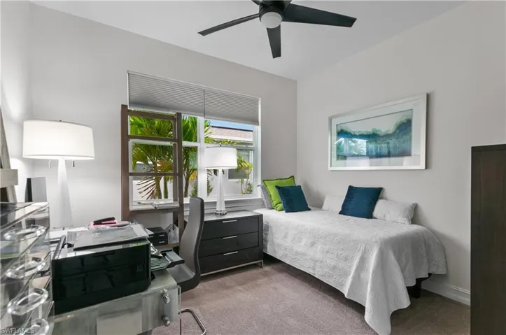 Neutral tone wall paint with a contrasting dark ceiling fan
