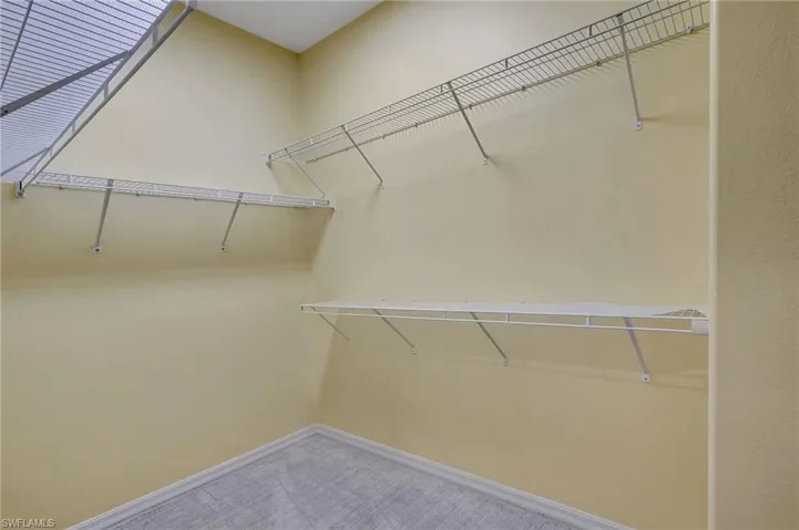 Walk in closet featuring carpet floors
