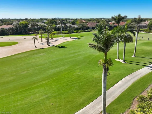 Expansive fairway views with a serene and tropical backdrop.