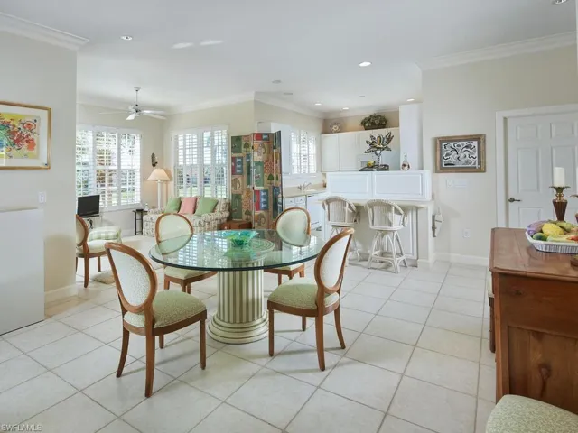 Elegant dining space with natural light and seamless flow into the living area.