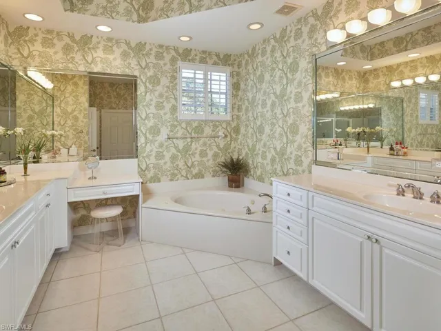 This bathroom is so spacious with separate sink areas for both of you PLUS a vanity area.