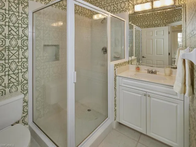 Well-appointed guest bathroom with a walk-in shower.