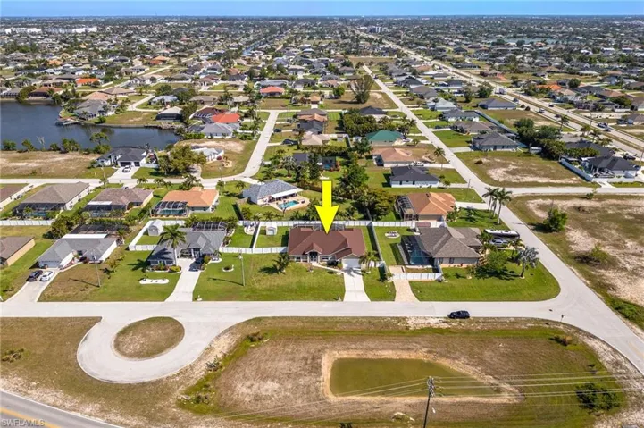 Drone / aerial view featuring a water view and a residential view