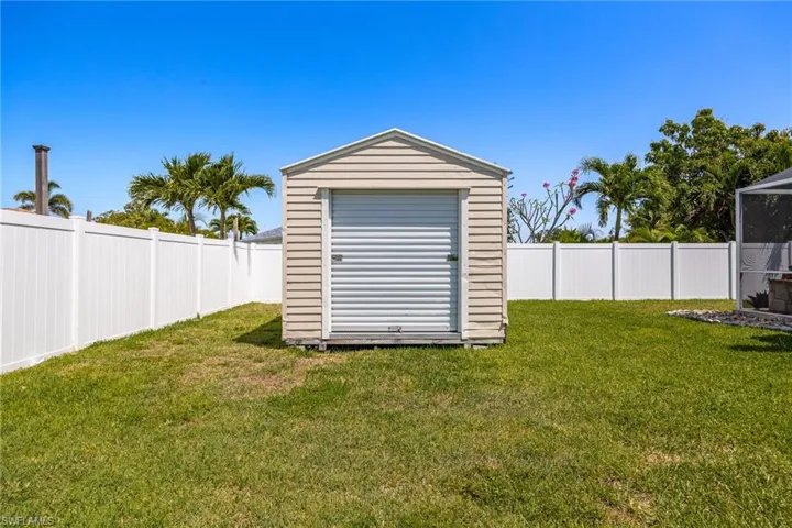View of shed featuring a fenced backyard
