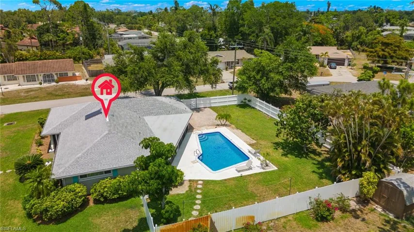 View of pool with a yard