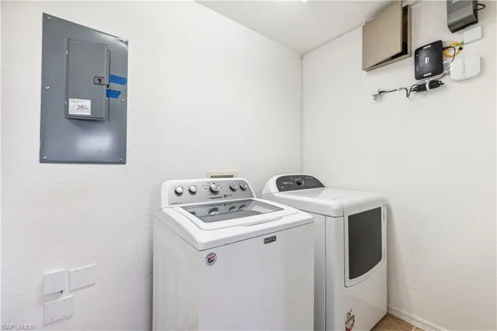 Laundry room next to kitchen.