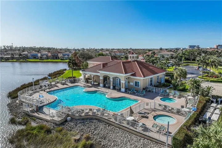 View of pool with a community hot tub and kiddie pool