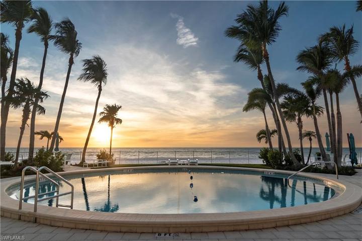 The tropical poolside landscape is healthy and makes for pretty silhouettes at dusk.