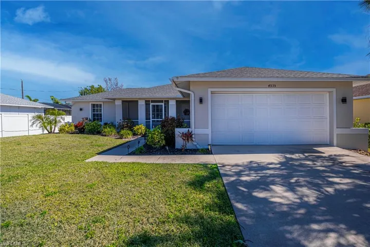 An abundance of curb appeal and large screened entry welcome you home!!