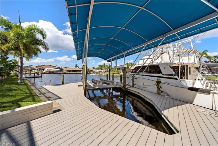 Dock with boat 20,000lb lift and a water view