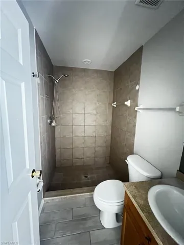 Full bathroom with a stall shower and vanity