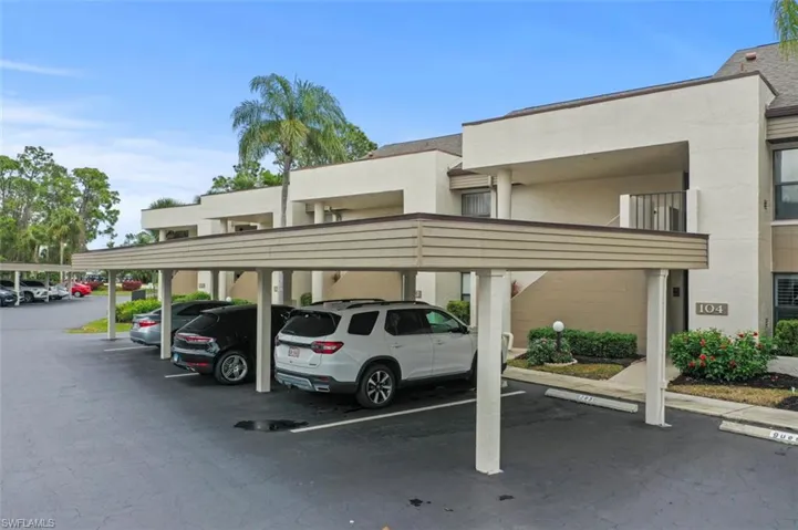 View of car parking featuring a carport