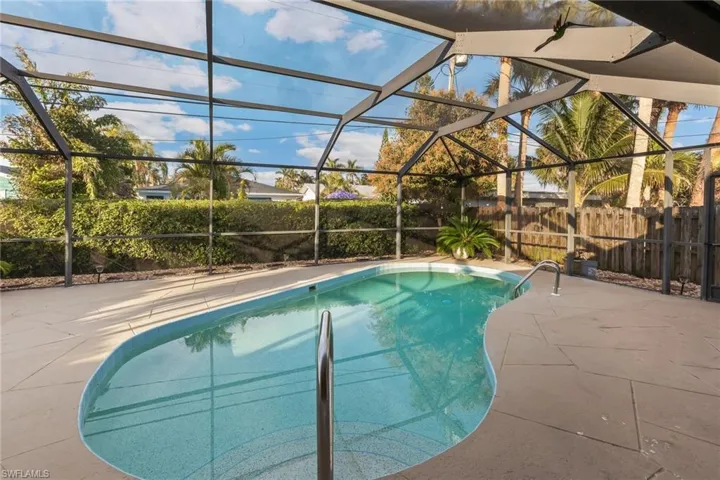 View of pool featuring a lanai and a patio area