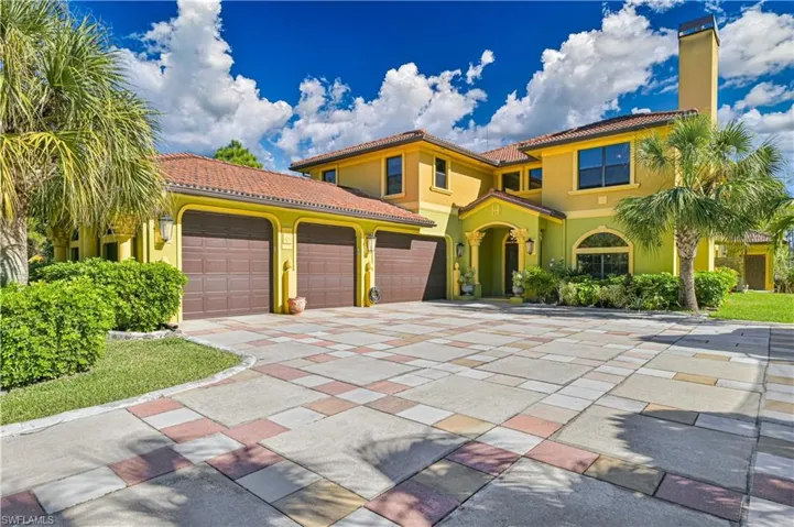 Front of home with 4 car garage