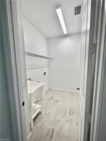 Nice size laundry room.