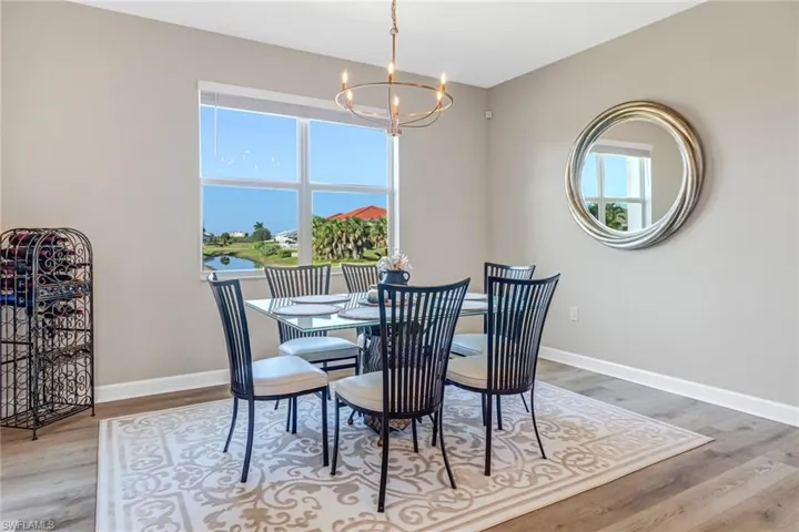 Dining area featuring a chandelier and light hardwood / wood-style flooring
