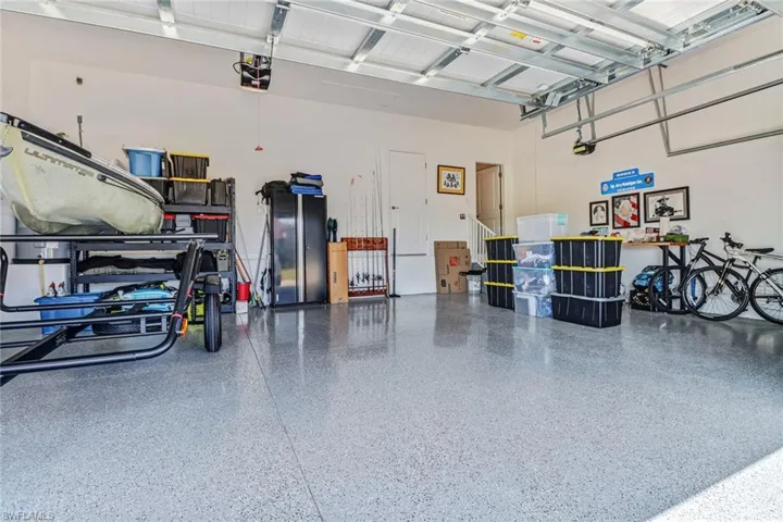 Garage featuring a garage door opener