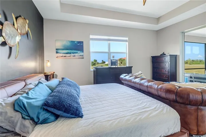 Bedroom featuring a raised ceiling