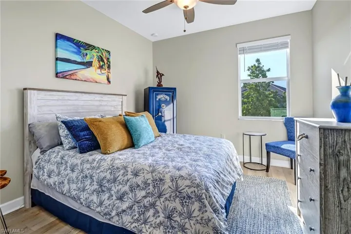 Bedroom featuring ceiling fan and light hardwood / wood-style floors