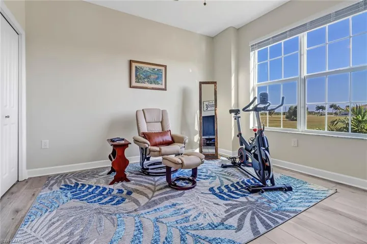 Exercise room featuring hardwood / wood-style flooring