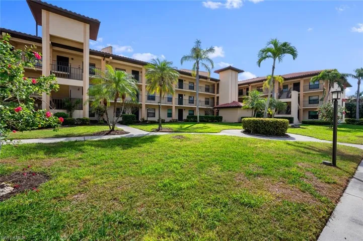 View of property's community with a yard