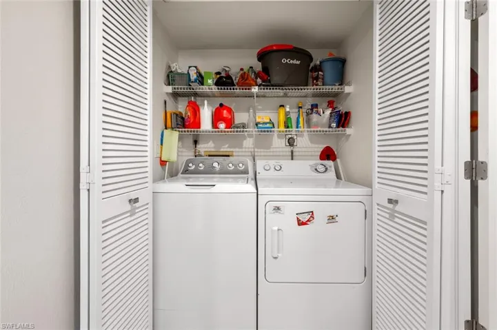 Clothes washing area featuring independent washer and dryer