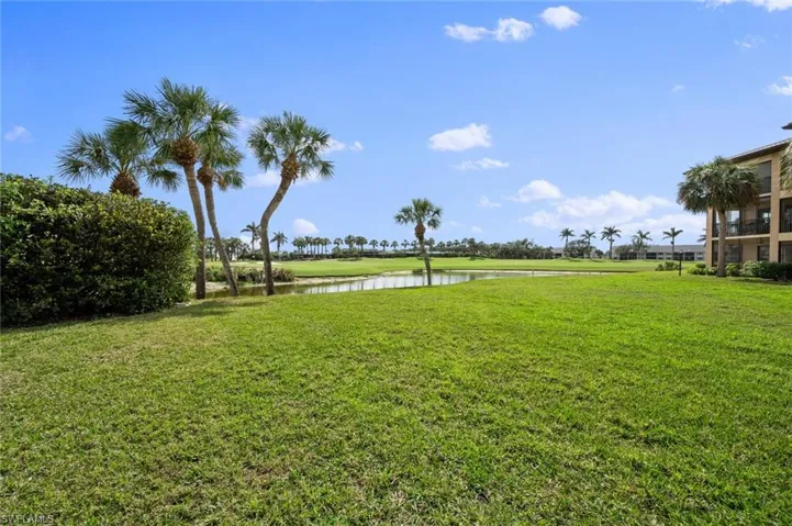 View of yard with a water view