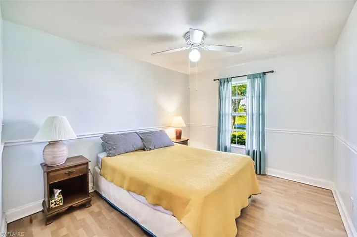 Bedroom featuring light wood-type flooring and ceiling fan