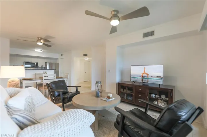Living room featuring ceiling fan