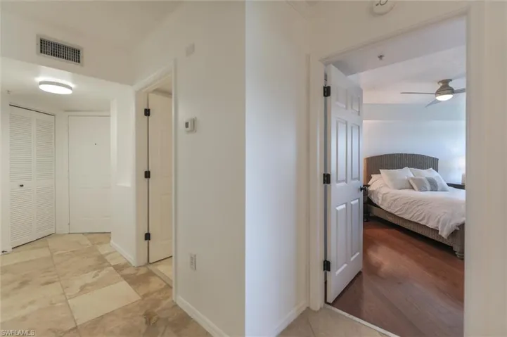 Hallway with light hardwood / wood-style floors