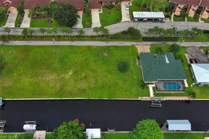 Drone / aerial view featuring a water view and a residential view
