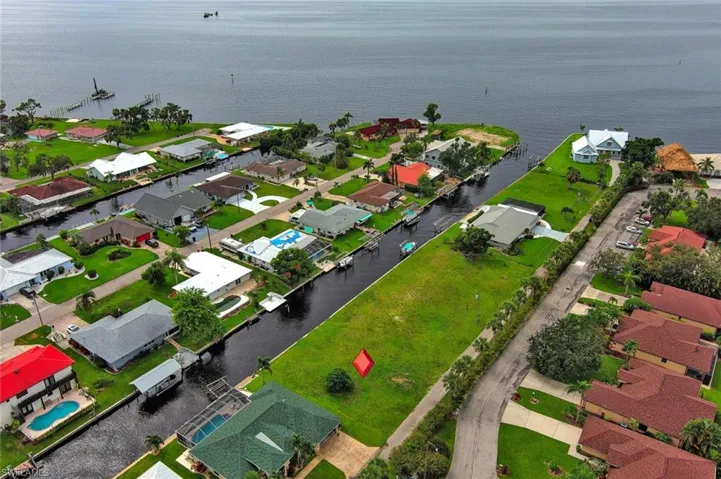 Drone / aerial view with a water view and a residential view