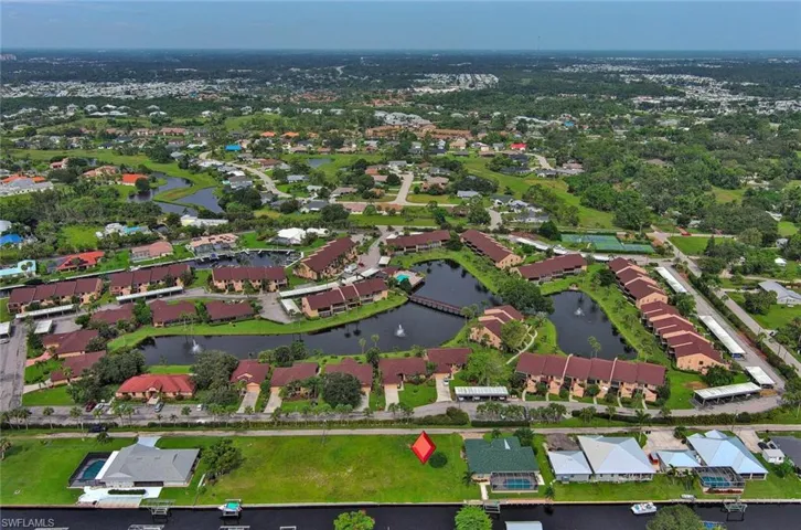 Aerial view featuring a residential view and a water view